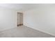 Spacious bedroom showcasing a neutral color palette and plush carpeting at 4896 S Dudley St # 8, Littleton, CO 80123