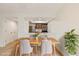 Dining area with wood table and a view into the kitchen at 4896 S Dudley St # 8, Littleton, CO 80123