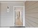 A bright entryway with light wood floors leading into the condo at 4896 S Dudley St # 8, Littleton, CO 80123