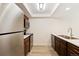 Modern kitchen featuring stainless steel appliances, and stylish cabinets at 4896 S Dudley St # 8, Littleton, CO 80123