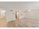 Bright living room boasts modern flooring, neutral paint, and flows into the kitchen area at 4896 S Dudley St # 8, Littleton, CO 80123