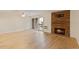 Spacious living room with a fireplace and sliding glass door to the balcony at 4896 S Dudley St # 8, Littleton, CO 80123