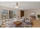 Cozy living room with a sliding glass door, brick fireplace, and neutral furniture at 4896 S Dudley St # 8, Littleton, CO 80123