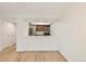 Open living space with hardwood floors, kitchen view, and closet space at 4896 S Dudley St # 8, Littleton, CO 80123
