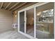 View of a patio with sliding glass doors leading into the condo at 4896 S Dudley St # 8, Littleton, CO 80123
