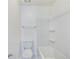 Bathroom with a white toilet, shower and tub featuring tiled walls, and chrome fixtures at 8770 Rainbow Ave # B4, Denver, CO 80229