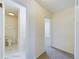Hallway view showcasing access to a bathroom and bedroom, providing seamless transitions in the home's layout at 8770 Rainbow Ave # B4, Denver, CO 80229