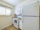 A well-lit kitchen features white cabinets, wood countertops, and modern appliances at 8770 Rainbow Ave # B4, Denver, CO 80229
