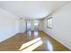 A bright, spacious living room with hardwood floors at 8770 Rainbow Ave # B4, Denver, CO 80229