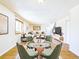 A bright living room with a dining area features contemporary decor and hardwood floors at 8770 Rainbow Ave # B4, Denver, CO 80229