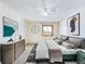 Comfortable main bedroom with a ceiling fan, a window and stylish furnishings creating a serene space at 8770 Rainbow Ave # B4, Denver, CO 80229