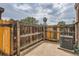 Private patio area with a wooden fence, perfect for outdoor relaxation and entertaining at 8770 Rainbow Ave # B4, Denver, CO 80229