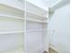 Bright walk-in closet with adjustable shelving and hanging rods for organization at 8770 Rainbow Ave # B4, Denver, CO 80229