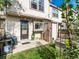 Cozy patio with string lights, grill, and small lawn at 9618 W Chatfield Ave # E, Littleton, CO 80128