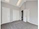 Bedroom with vaulted ceiling, gray carpet, and skylights at 9618 W Chatfield Ave # E, Littleton, CO 80128