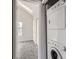 Stackable washer and dryer in a laundry closet at 9618 W Chatfield Ave # E, Littleton, CO 80128