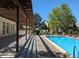 Relaxing pool area featuring a pergola and patio at 9618 W Chatfield Ave # E, Littleton, CO 80128