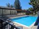 Community pool with adjacent patio and pergola at 9618 W Chatfield Ave # E, Littleton, CO 80128