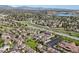 Scenic aerial of the neighborhood near lake, green areas, and winding roads at 6809 S Webster St # F, Littleton, CO 80128