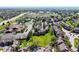 High angle aerial showcases community near green space, shopping, and roads at 6809 S Webster St # F, Littleton, CO 80128