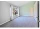 Bright bedroom with a large window and soft carpeting at 6809 S Webster St # F, Littleton, CO 80128