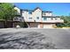 Condo complex featuring garages and small patios at 6809 S Webster St # F, Littleton, CO 80128