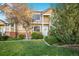 Charming townhome with well-maintained landscaping, brick accents, and a welcoming entrance at 6809 S Webster St # F, Littleton, CO 80128