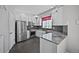 Well-appointed kitchen with stainless steel appliances, granite countertops, and white cabinetry at 6809 S Webster St # F, Littleton, CO 80128