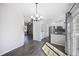 Bright, open kitchen featuring stainless steel appliances and a stylish breakfast bar area at 6809 S Webster St # F, Littleton, CO 80128