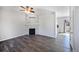 Modern living room with a stylish fireplace, hardwood floors, and neutral color palette at 6809 S Webster St # F, Littleton, CO 80128