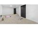 Spacious carpeted basement with workout mats and closet storage at 982 S Holly St, Denver, CO 80246