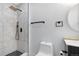 Modern bathroom features striking stone tile, rainfall shower head, and sleek black fixtures at 982 S Holly St, Denver, CO 80246