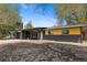 Beautifully landscaped yard and modern exterior of a single-story home at 982 S Holly St, Denver, CO 80246