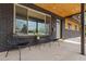 Inviting front porch with stylish seating and a view of the well-maintained front yard at 982 S Holly St, Denver, CO 80246