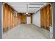 Spacious two-car garage with unfinished walls and concrete flooring at 982 S Holly St, Denver, CO 80246