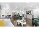 Open floor plan with a combined living and dining area at 982 S Holly St, Denver, CO 80246