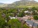 Picturesque aerial view of a charming neighborhood nestled among lush trees and rolling hillsides at 1029 N Columbine St, Golden, CO 80403