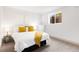 Comfortable bedroom with a queen bed, yellow accents, and a window at 1029 N Columbine St, Golden, CO 80403