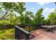 Enjoy outdoor living on this spacious deck overlooking a lush backyard with mature trees and open sky at 1029 N Columbine St, Golden, CO 80403
