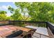 Outdoor deck area with mountain views, wood furniture, and a lounge area with stylish seating at 1029 N Columbine St, Golden, CO 80403
