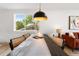 Dining area featuring a large table, stylish chairs, and natural light from a nearby window at 1029 N Columbine St, Golden, CO 80403