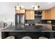 Modern kitchen featuring stainless steel appliances, a sleek island, and stylish pendant lighting at 1029 N Columbine St, Golden, CO 80403
