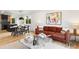 Open-concept living area with a sofa, modern decor, and a seamless flow into the dining space at 1029 N Columbine St, Golden, CO 80403