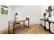 Bright office space with hardwood floors, a rustic desk, and a modern storage cabinet at 1029 N Columbine St, Golden, CO 80403