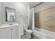 Bathroom featuring shower, white cabinets, and large mirror at 9175 Cole Dr, Arvada, CO 80004