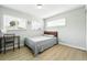 Bedroom featuring ample natural light, plank floors, and a clean design at 9175 Cole Dr, Arvada, CO 80004