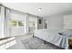 Sunlit bedroom with large windows and neutral decor at 9175 Cole Dr, Arvada, CO 80004
