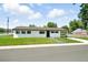 Well-maintained front yard with lush green grass and charming curb appeal at 9175 Cole Dr, Arvada, CO 80004