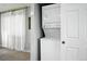 A stackable Frigidaire washer and dryer appliance is conveniently located near a doorway at 9175 Cole Dr, Arvada, CO 80004