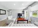 Bright living room features light gray walls, wood flooring, and access to the backyard at 9175 Cole Dr, Arvada, CO 80004